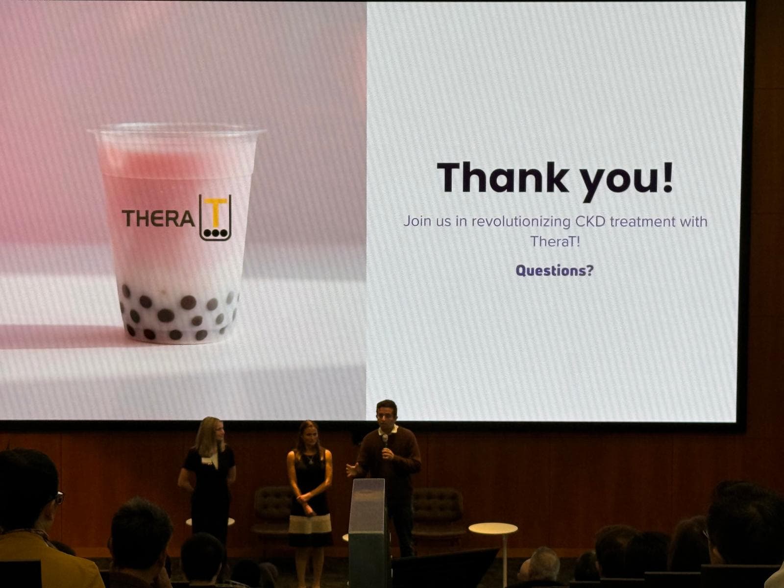 TheraT team presenting on stage at Nucleate PNW Demo Day at the Allen Institute.