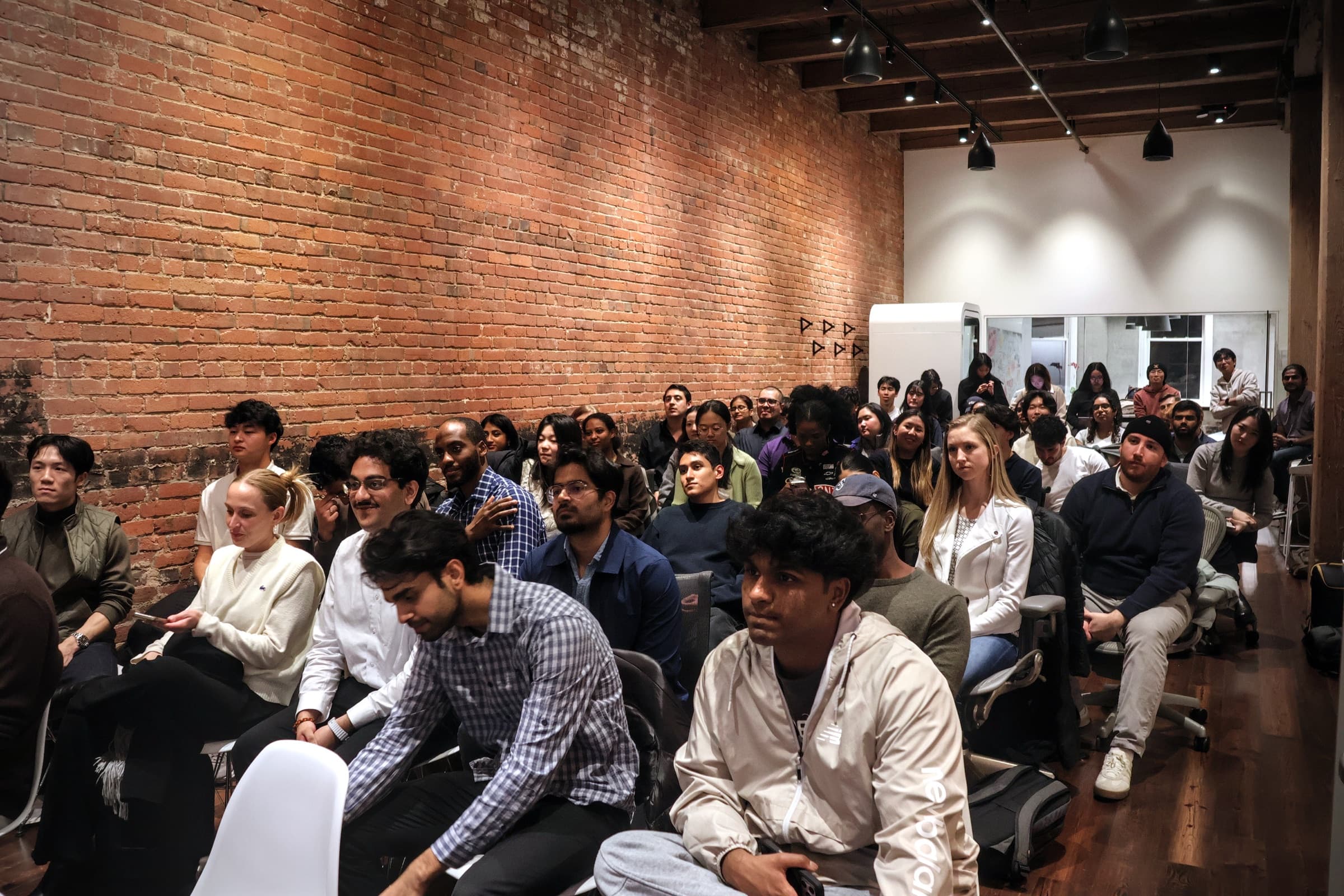 Students seated in the audience during demo day at Pioneer Square Labs.
